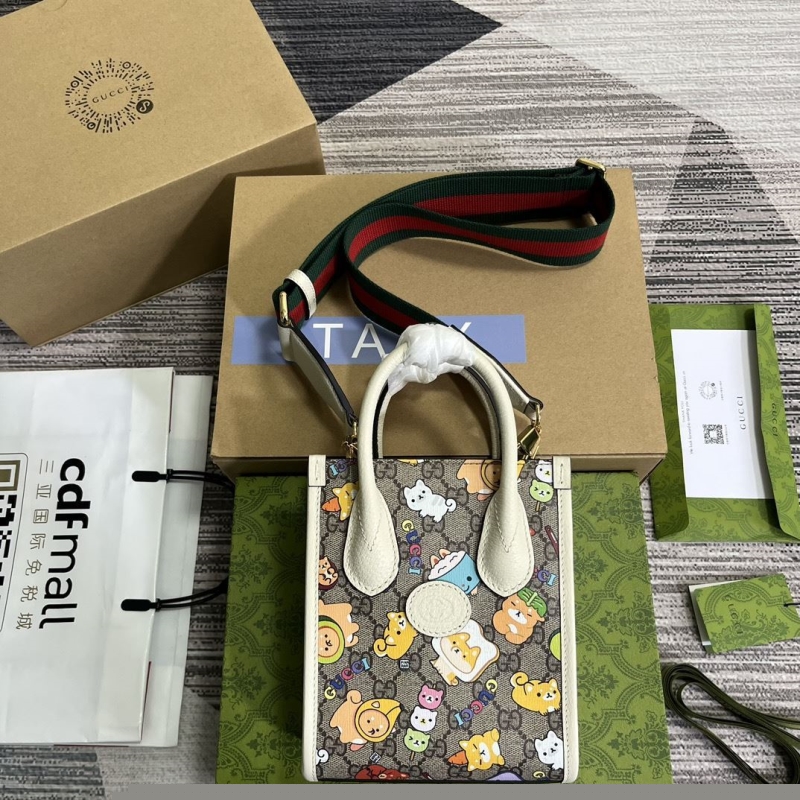 G*u*i top handle bags